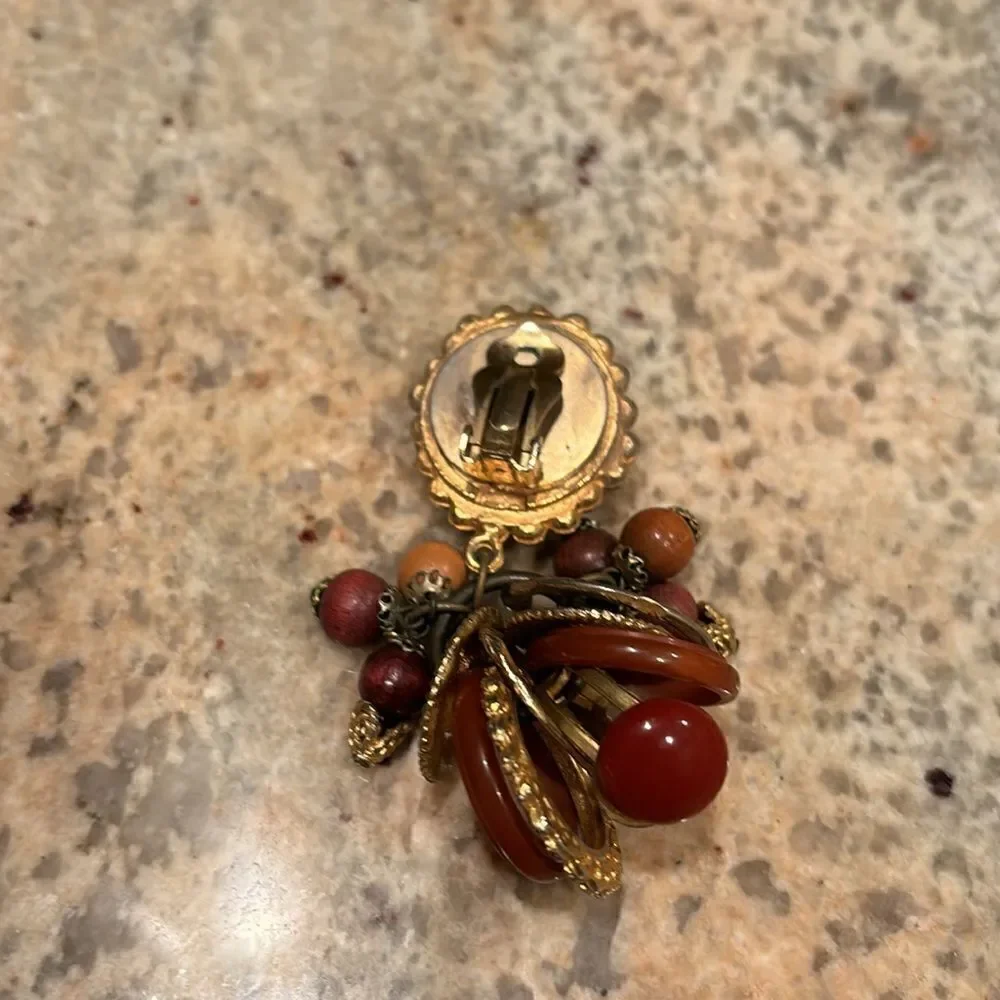 Woman's beaded clip on earring. It's only one earring